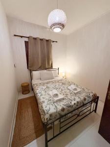a bedroom with a bed in a room at Gorgyra - Boutique Apartment in Karlovasi