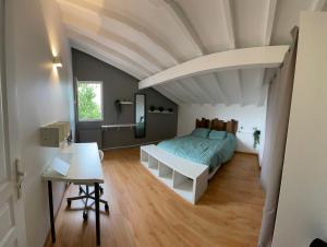 a bedroom with a bed and a white ceiling at Maison familiale in Bidart +17 photos