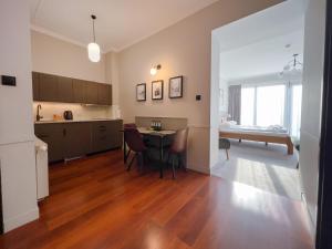a kitchen and dining room with a table and a dining room at Willa 654 in Szklarska Poręba