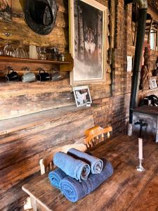 a wooden room with a table with towels on it at La Cabane Aux Loups in Crépy-en-Valois +35 photos