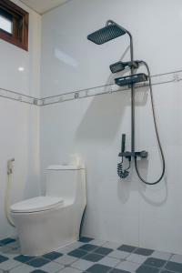 a bathroom with a toilet and a shower at Hue garden homestay in Thôn Trường Giang