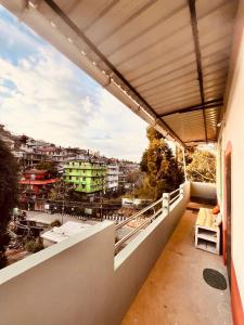 a balcony with a view of a city at Kusum Nest in Shillong