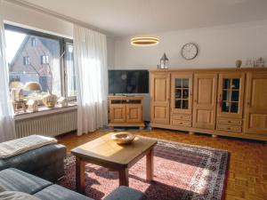a living room with a couch and a table at Xantenglück in Xanten