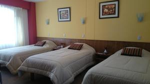 Postel nebo postele na pokoji v ubytování Hotel Munay Tambo