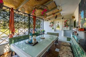 a kitchen with a glass table in a room at Holiday house Goran, Opuzen in Opuzen