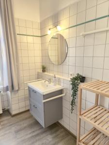 a bathroom with a sink and a mirror at Weingut Caspari, Familie Eggert in Traben-Trarbach +73 photos
