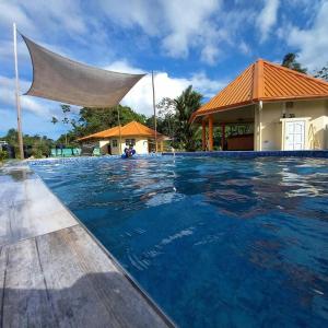 a swimming pool at the resort at Surinat Luxury Resort in Domburg