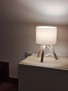 a lamp sitting on top of a table at Ribeira Mar Guesthouse in Viana do Castelo
