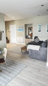 a bedroom with a bed and a table in it at Little Gem in Swanage