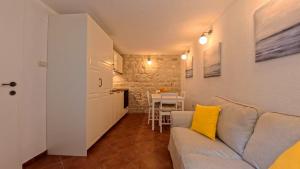 a living room with a couch and a table at Old Town Stay by Ivo in Trogir