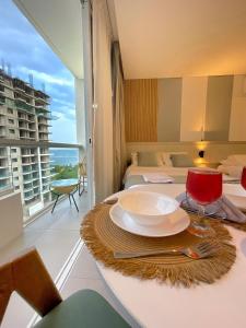 a room with a table with a plate on it at Porto Horizonte SUITE 904 in Santa Marta