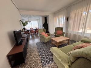 a living room with a couch and chairs and a table at Mediterranean House in Valencia in Valencia