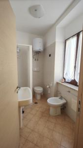 a bathroom with a toilet and a sink at Casa Vacanze Cesarina - Catanzaro centro in Catanzaro