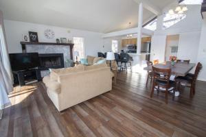 a living room with a couch and a table at Margarita Manor on Staniel Cay in Osage Beach