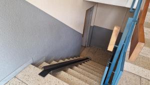 an overhead view of a staircase with a black bench at Lian am See in Friedrichshafen