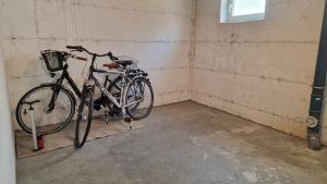 a bike parked in a corner of a room at Lian am See in Friedrichshafen