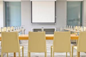 a conference room with a long table and chairs at Barceló Teguise Beach - Adults Only in Costa Teguise