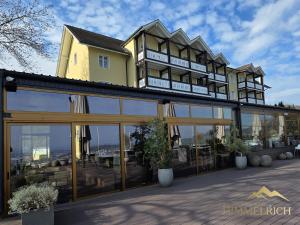 a large building with glass doors and windows at Boutique Hotel Himmelrich in Lucerne