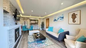 a living room with a couch and a table at Casa Azul in Ferrel
