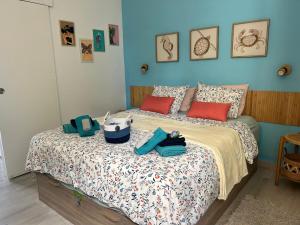 a bedroom with a bed with two bags on it at Casa ART residenza Bouganville in Costa de Antigua +25 photos