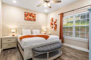 a bedroom with a large bed and a window at On the Rocks Lodge in Branson +52 photos