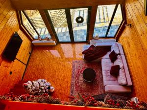an overhead view of a living room with a couch at Twin Cabins Azuga in Azuga