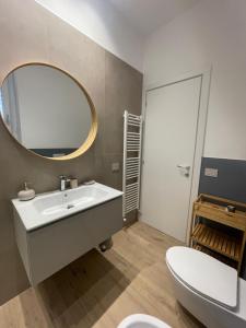a bathroom with a white sink and a mirror at Credo Mare Luxury Stay - Comfort in Pescara