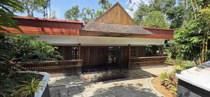 a building with a roof on top of it at Ourea's Rest in Thekkady