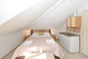 a bedroom with a bed in a attic at Old town central in Kotor