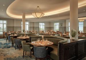 a dining room with tables and chairs at Galway Bay Hotel Conference & Leisure Centre in Galway +43 photos