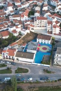 an aerial view of a city with buildings at vila gira odeceixe in Odeceixe +15 photos