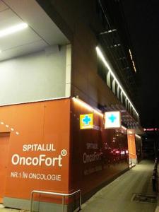 a building with a sign on the side of it at decebal premium apartment in Bucharest