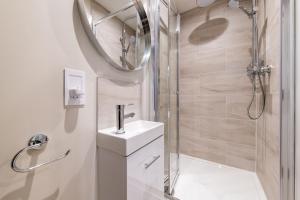 a white bathroom with a sink and a shower at Gillingham Luxury, LNG GRAIN, Workers, Parking, Flexible Weekly Deals in Gillingham +30 photos