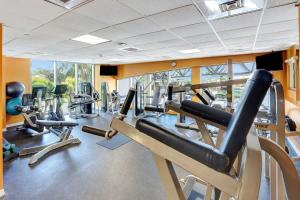 a gym with several treadmills and cardio machines at Marenas Resort Beachfront Condo with Direct Access in Sunny Isles Beach