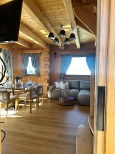 a living room with a couch and a table at Little House in Ząb