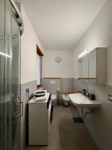 a bathroom with a sink and a toilet and a shower at Ca' de Mario in Sondalo +13 photos