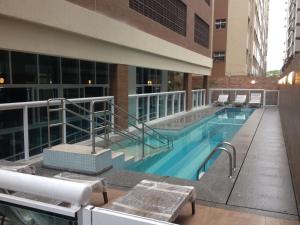 a swimming pool on the side of a building at Unique Santos - Flat 1105 in Santos