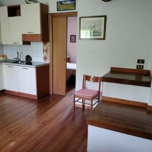 a kitchen with a table and a chair in a room at Agriturismo Praetto in Marcon
