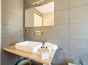 a bathroom with a sink and a mirror at Terrazza San Martino Private Terrace Stay in Monopoli +12 photos