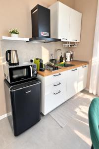 A kitchen or kitchenette at Loft Monte Cinto 2
