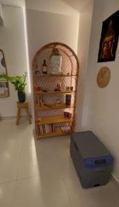 a room with a suitcase on the floor next to a wall at Solua Hostel in Santos