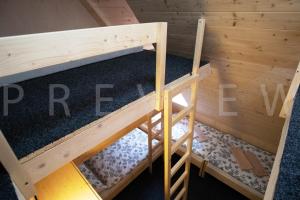 an overhead view of a bunk bed in a room at Ťatliakova chata in Zuberec
