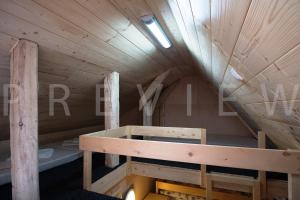 a wooden cabin with a staircase in the attic at Ťatliakova chata in Zuberec +24 photos