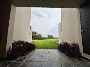 an entrance to a building with a view of a field at Nestled sanctuary in Northriding