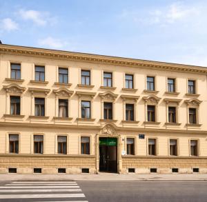 a large building with a door in the front of it at Palmotić Heritage Suites - Main Square - FREE Parking in Zagreb