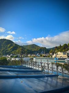 a view of a body of water with mountains in the background at DieMosel Minimal in Traben-Trarbach