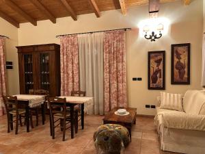 a living room with a couch and a table at B&B La Collina degli Ulivi in Zola Predosa