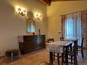 a dining room with a table and a mirror at B&B La Collina degli Ulivi in Zola Predosa +42 photos