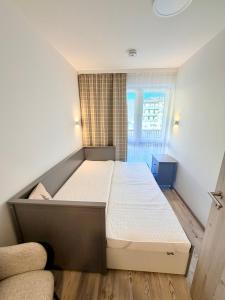 a bedroom with a large bed in a room at GG Apartment 8 in Garmisch-Partenkirchen
