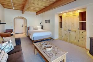 a living room with a bed and a couch at Timberline Condominiums Studio Deluxe Unit 215 in Snowmass Village